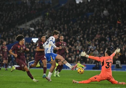 Brighton's English-born Danish midfielder #33 Matt O'Riley (C) scores their second goal past Manchester City's Brazilian goalkeeper #31 Ederson (R) during the English Premier League football match between Brighton and Hove Albion and Manchester City at the American Express Community Stadium in Brighton, southern England on November 9, 2024. (Photo by Glyn KIRK / AFP) / RESTRICTED TO EDITORIAL USE. No use with unauthorized audio, video, data, fixture lists, club/league logos or 'live' services. Online in-match use limited to 120 images. An additional 40 images may be used in extra time. No video emulation. Social media in-match use limited to 120 images. An additional 40 images may be used in extra time. No use in betting publications, games or single club/league/player publications. /  (Photo by GLYN KIRK/AFP via Getty Images)