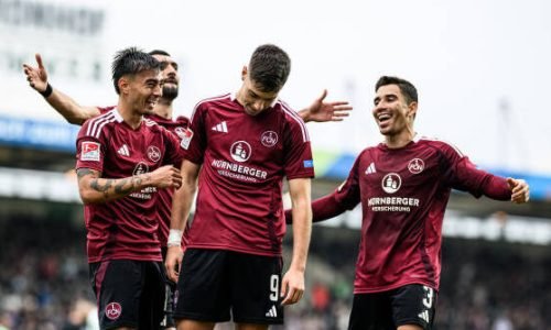 FUERTH, GERMANY - OCTOBER 20: (EDITORS NOTE: Image has been digitally enhanced.) Stefanos Tzimas of 1. FC Nürnberg celebrates with team mates after scoring his team’s third goal during the Second Bundesliga match between SpVgg Greuther Fürth 1903 and 1. FC Nürnberg at Sportpark Ronhof Thomas Sommer on October 20, 2024 in Fuerth, Germany. (Photo by Sebastian Widmann/Bundesliga/Bundesliga Collection via Getty Images)