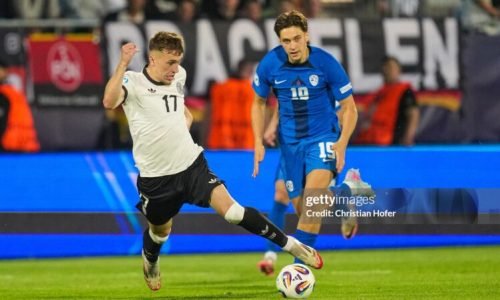 NITRA, SLOVAKIA - JUNE 12: Brajan Gruda of U21 Germany in action against Enrik Ostrc of U21 Slovenia during the UEFA European Under-21 Championship 2025 Group Stage match between Germany and Slovenia at Nitra Stadium on June 12, 2025 in Nitra, Slovakia. (Photo by Christian Hofer/Getty Images)