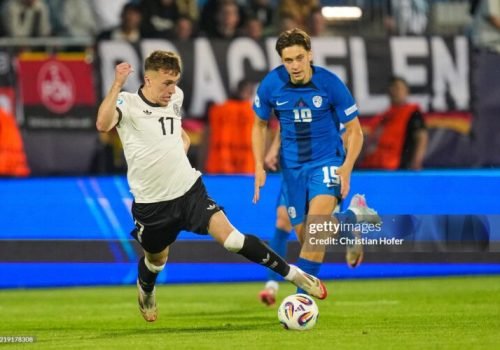 NITRA, SLOVAKIA - JUNE 12: Brajan Gruda of U21 Germany in action against Enrik Ostrc of U21 Slovenia during the UEFA European Under-21 Championship 2025 Group Stage match between Germany and Slovenia at Nitra Stadium on June 12, 2025 in Nitra, Slovakia. (Photo by Christian Hofer/Getty Images)